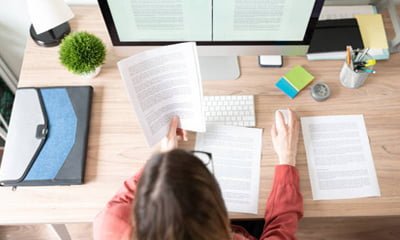 Woman reviewing Copywriting at her computer