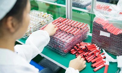 Manufacturing plant worker sorting materials