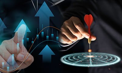 Man touching a graphs and placing a dart on a bullseye
